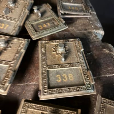 A Group of National Cast Brass Post Office Box Doors Dated 1955