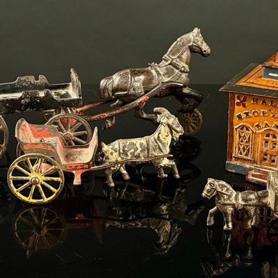 A Collection of Antique Cast Iron Animal-Drawn Toys and a Hall's Excelsior Mechanical Bank