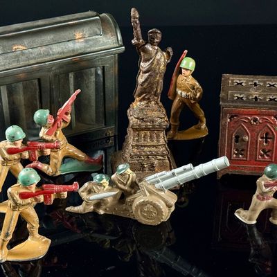 A Collection of Vintage Cast Metal Savings Banks and Military Figures
