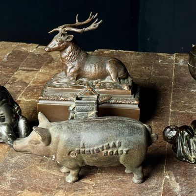 An Assortment of Cast Metal Figurines Including Johann Baptist Stiglmaier Stag and A Christmas Roast Pig Bank