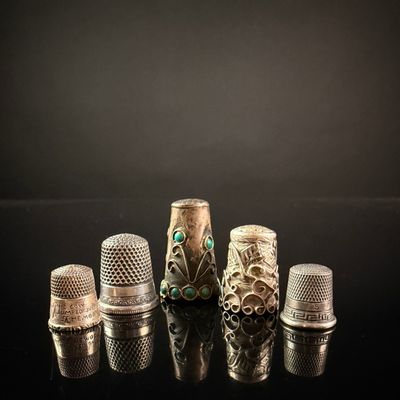 Sale Photo Thumbnail #214: A Collection of Five Sterling Silver Thimbles including a Simons Bros. Nursery Rhyme Example