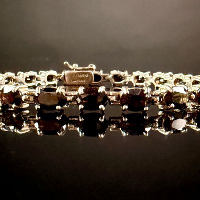 Sale Photo Thumbnail #112: Sterling Silver and Oval-Cut Garnet Tennis Bracelet