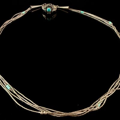 Sale Photo Thumbnail #149: A Navajo Lot of Sterling Silver and Turquoise Jewelry Comprising a Multi-Strand Necklace and a Floral Motif Ring