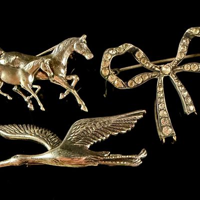 Sale Photo Thumbnail #94: A Trio of Vintage Sterling Silver Brooches Including Horse and Bird Motifs
