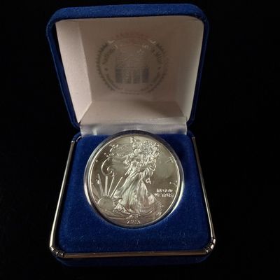 Sale Photo Thumbnail #201: US 2013 American Silver Eagle One Dollar 1 oz Fine Silver Coin in National Collector's Mint Box
