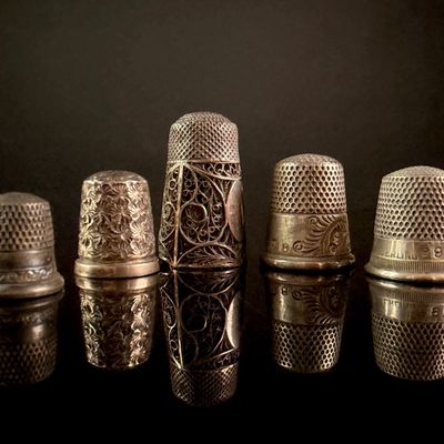 Sale Photo Thumbnail #3: A Collection of Five Sterling Silver Thimbles Including Victorian Repousse and Filigree Examples