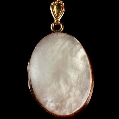 Sale Photo Thumbnail #218: Twelve Karat Gold-Filled and Mother-of-Pearl Oval Locket Pendant