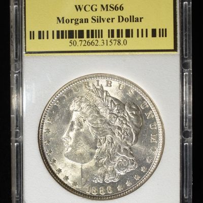 Sale Photo Thumbnail #234: 1886 MORGAN DOLLAR WCG SUPERB GEM BU