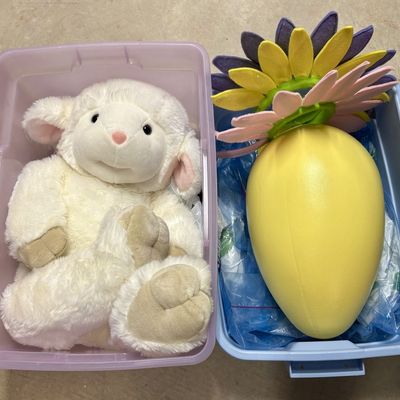 Sale Photo Thumbnail #293: Two Oversized Seasonal Decorative Items Including a Plush Lamb and a Floral Egg Prop with Storage Bins