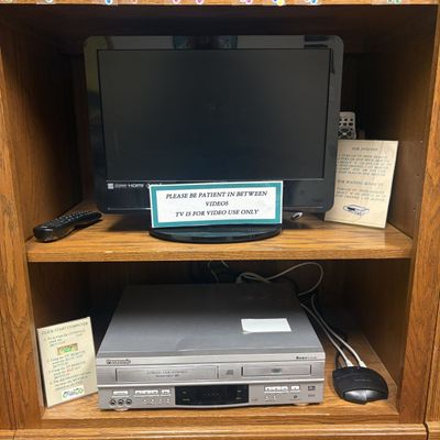 Sale Photo Thumbnail #204: A Flat-Screen Television and a Panasonic DVD and VHS Player Combo Unit