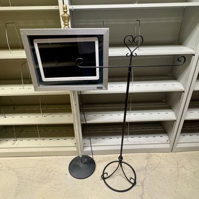 Sale Photo Thumbnail #378: Two Display Stands Including a Framed Digital Media Player on Pedestal and a Wrought Iron Style Banner Stand