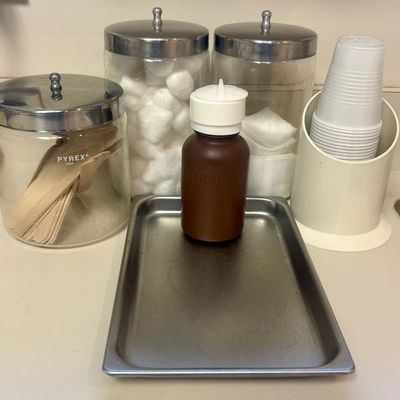 Sale Photo Thumbnail #126: A Collection of Vintage Clinical Supplies Including Pyrex Glass Jars and Stainless Steel Tray