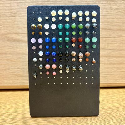 Sale Photo Thumbnail #334: An Assortment of Approximately 50 Pairs of Sterling Base Gemstone and Pearl Style Stud Earrings on a Black Acrylic Stand