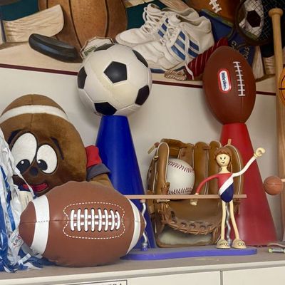 Sale Photo Thumbnail #190: An Assortment of Sports-Themed Toys and Decorative Items Including Little Tikes and Bendis