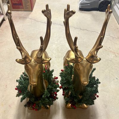 Sale Photo Thumbnail #302: A Pair of Large Decorative Seated Gold Reindeer Figures