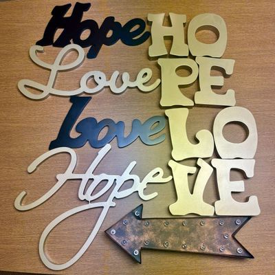 Sale Photo Thumbnail #262: A Collection of Nine Contemporary Metal Wall Hangings Featuring Hope and Love Themes