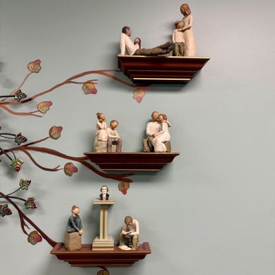 Sale Photo Thumbnail #29: A Collection of Decorative Figurines and Tiered Wall Shelves