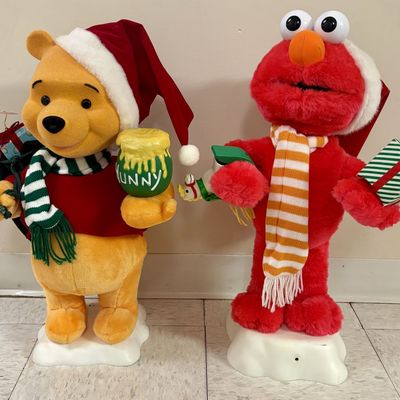 Sale Photo Thumbnail #413: A Pair of Telco Creations Inc Animated Holiday Figures Featuring Disney Winnie the Pooh and Sesame Street Elmo