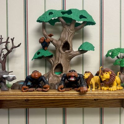 Sale Photo Thumbnail #120: A Collection of Safari Themed Plastic Toy Animals and Jungle Environment Pieces