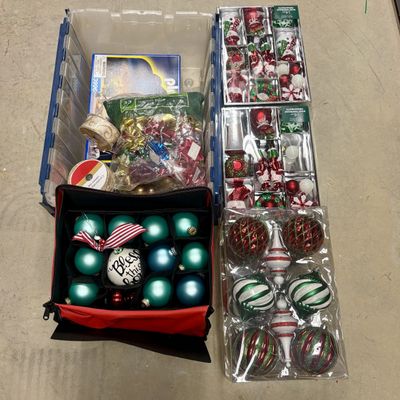 Sale Photo Thumbnail #314: A Collection of Holiday Decorations Gift Wrapping Supplies and a Playmobil Toy Set in a Plastic Storage Tote