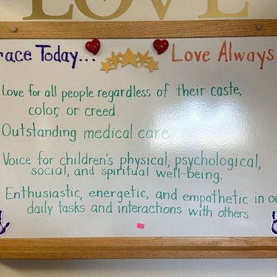 Sale Photo Thumbnail #213: Large Framed Oak Whiteboard with Medical Mission Statement