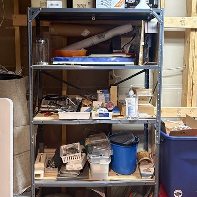 Sale Photo Thumbnail #402: An Assortment of Household, Office, Lighting, and Medical Supplies on a Five-Tier Steel Shelving Unit