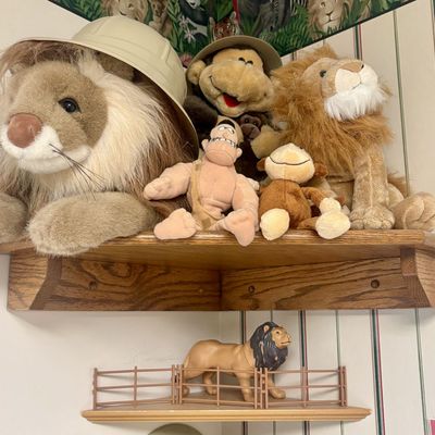 Sale Photo Thumbnail #117: A Collection of Safari Themed Plush Figures and Molded Plastic Lion with Corner Wall Shelving