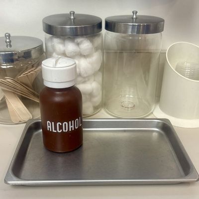 Sale Photo Thumbnail #104: An Assortment of Medical Storage and Dispensing Items including Pyrex Glass Jars