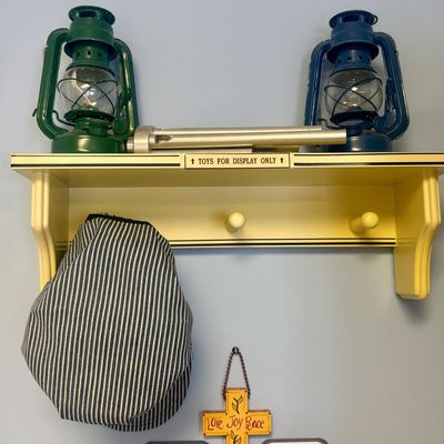 Sale Photo Thumbnail #153: A Collection of Railroad-Themed Decorative Items including Brio Engineer's Cap and Wall Shelf