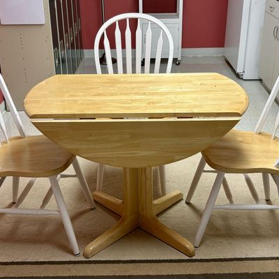 Sale Photo Thumbnail #229: A Four-Piece Two-Tone Wood Drop-Leaf Dining Set Comprising a Pedestal Table and Three Windsor Style Side Chairs