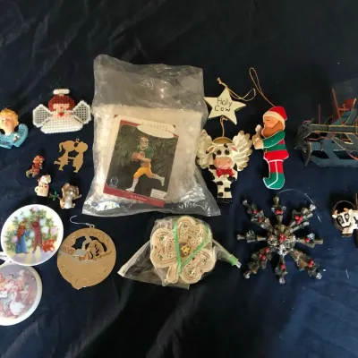 Festive vintage Christmas décor lot featuring three holiday pieces:  * Santa figure dressed as a toy