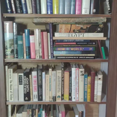 Four Shelves Of Mostly Hardbound Books