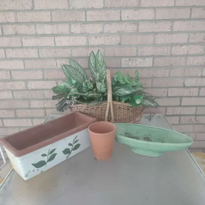Clay Pots And A Basket Of Faux Greenery 