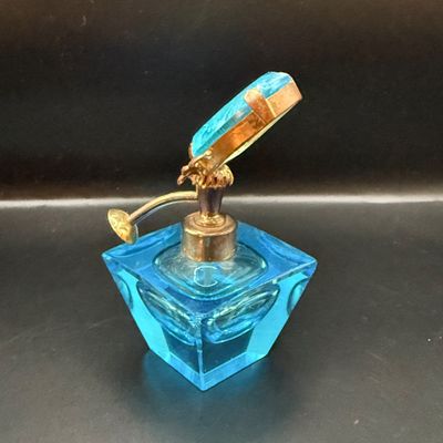 LOT 255: Amber Glass Perfume Bottler with Feather Fan Stopper, Blue Glass Cameo Perfume Atomizer and Amber Glass Bowl