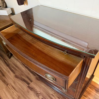 LOT 182: Bowed Front Chest of Drawers with Pull-Out Slide and Oval Hardware and Removable Glass Top