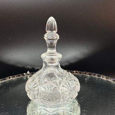 LOT 254: Mirrored Vanity Tray with Perfume Bottles Including Jordache Perfume by Armani and Guerlain Baccarat Bottle and More