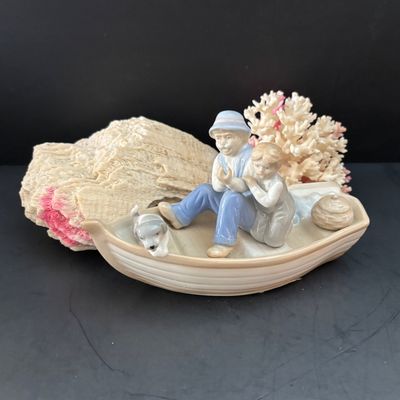 LOT 108: Nautical Collection of Seashell Ships, Meico Paul Sebastian "Fishing w/Grandfather" Porcelain Figurine, Large Corals...