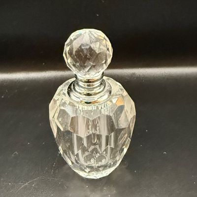 LOT 257: Collection of Cut Crystal Perfume Bottles by Oleg Cassini and More