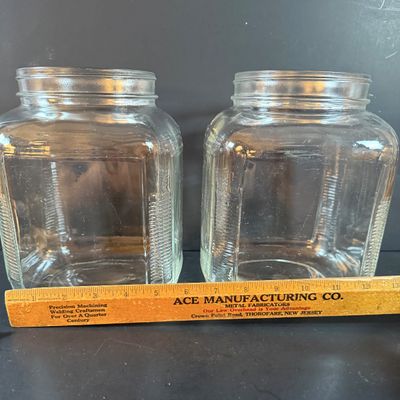 LOT 1: Vintage Large Wide Mouth Glass Jars, Cast Iron Match Dispenser, Cast Iron Pennsylvania Dutch Style Trivets and Cast Iron Hook
