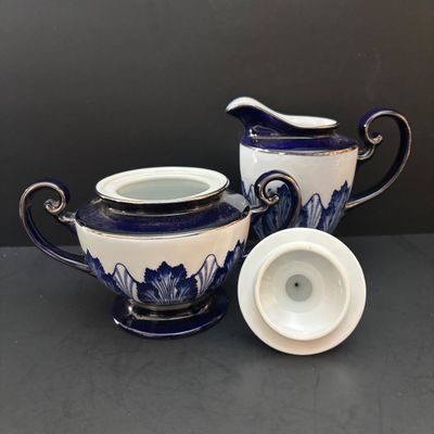 LOT 97: Bombay & Company Arabesque Cobalt Blue & White Teapot, Sugar Bowl, Creamer