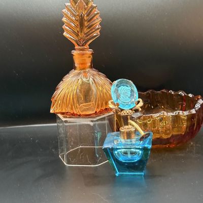 LOT 255: Amber Glass Perfume Bottler with Feather Fan Stopper, Blue Glass Cameo Perfume Atomizer and Amber Glass Bowl