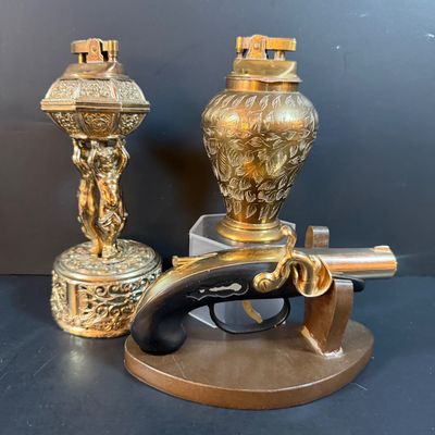 LOT 251: Collection of Desk Lighters Featuring an Antique Cherub Music Box Ligher and More