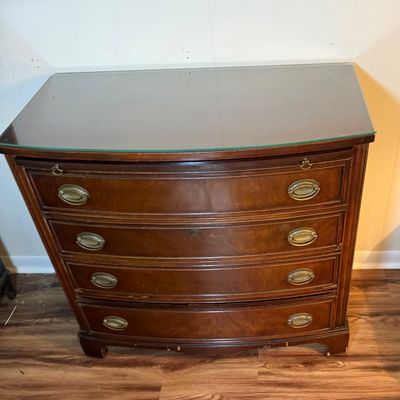 LOT 182: Bowed Front Chest of Drawers with Pull-Out Slide and Oval Hardware and Removable Glass Top
