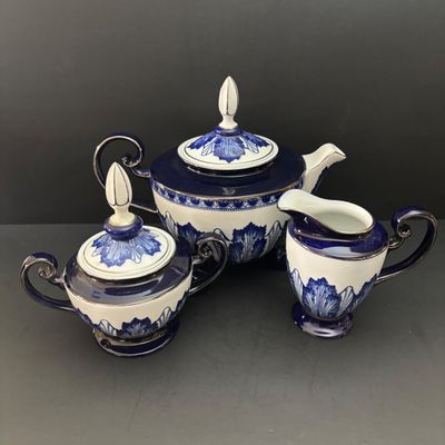 LOT 97: Bombay & Company Arabesque Cobalt Blue & White Teapot, Sugar Bowl, Creamer