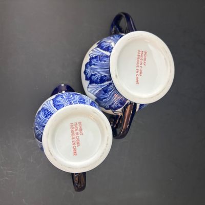 LOT 97: Bombay & Company Arabesque Cobalt Blue & White Teapot, Sugar Bowl, Creamer