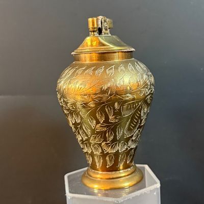 LOT 251: Collection of Desk Lighters Featuring an Antique Cherub Music Box Ligher and More