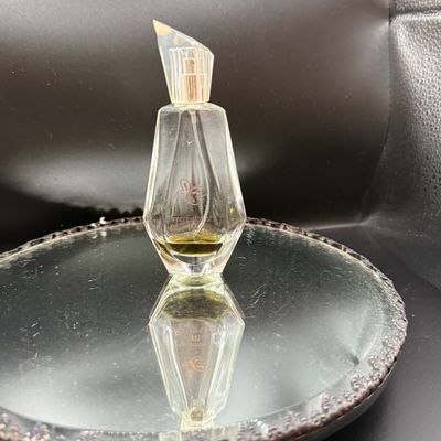 LOT 254: Mirrored Vanity Tray with Perfume Bottles Including Jordache Perfume by Armani and Guerlain Baccarat Bottle and More