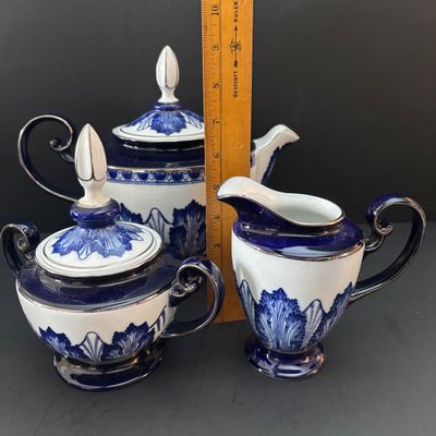 LOT 97: Bombay & Company Arabesque Cobalt Blue & White Teapot, Sugar Bowl, Creamer