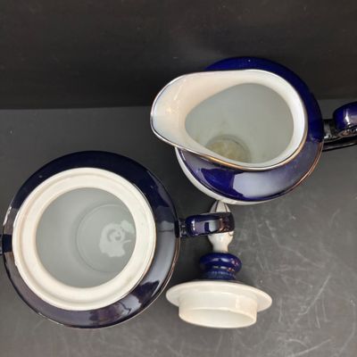 LOT 97: Bombay & Company Arabesque Cobalt Blue & White Teapot, Sugar Bowl, Creamer