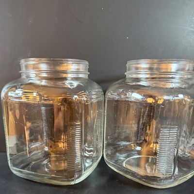 LOT 1: Vintage Large Wide Mouth Glass Jars, Cast Iron Match Dispenser, Cast Iron Pennsylvania Dutch Style Trivets and Cast Iron Hook